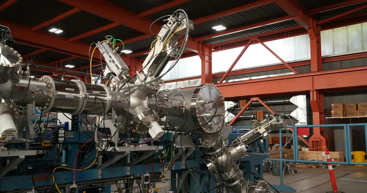 Stainless steel vacuum chamber and flange assembly of the kind that gets a helium leak test